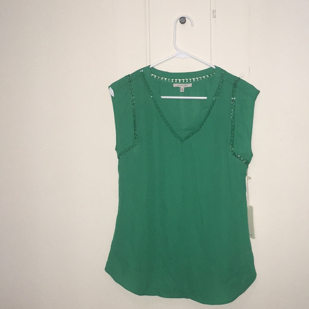 Green sleeveless blouse
